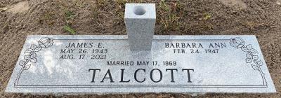headstone for two people with long stemmed rose design